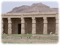 The mortury temple of Seti I with the hills of the Valley of the Kings behind.